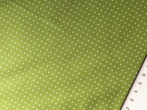 Tissu a pois sur fond vert