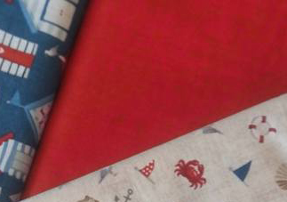 Tissu rouge coquillages